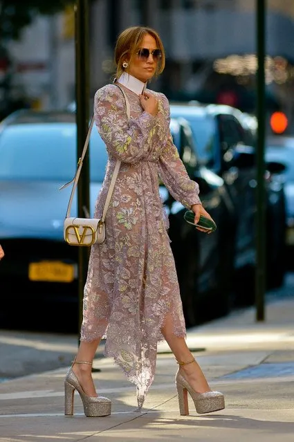 American singer Jennifer Lopez walking in long sheer floral dress and silver high pumps in New York City on Sunday, August 14th, 2022. (Photo by Luis Yllanes/Splash News and Pictures)