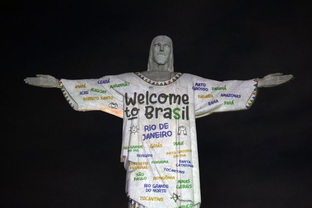 An image projected onto Christ the Redeemer welcomes US singer Taylor Swift to Rio de Janeiro, Brazil, on November 16, 2023. Swift will offer three shows of “The Eras Tour” in Rio de Janeiro. (Photo by Florian Plaucher/AFP Photo)