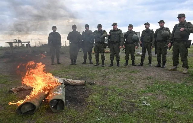 Newly-mobilized reservists take part in training on a range in Rostov region, Russia on October 4, 2022. Reports have surfaced of men with no military experience or past draft age receiving call-up papers, adding to outrage that has reignited dormant – and banned – anti-war demonstrations. Tens of thousands of men seeking to avoid the draft have already fled abroad, and the public remains concerned that the mobilisation could be expanded. (Photo by Sergey Pivovarov/Reuters)