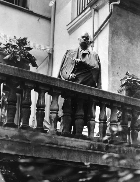 Russian novelist Maxim Gorky (Alexei Maksimovich Peshkov, 1868–1936) looking down from a balcony with his arm in a sling, shortly after recovery from an illness, 1932. (Photo by General Photographic Agency)