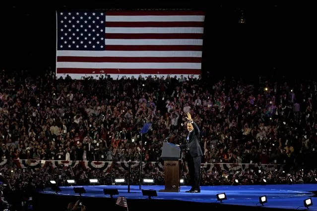 President Barack Obama waves to his supporters before giving his victory speech at his election night party in Chicago on November 7, 2012. (Photo by M. Spencer Green/Associated Press)
