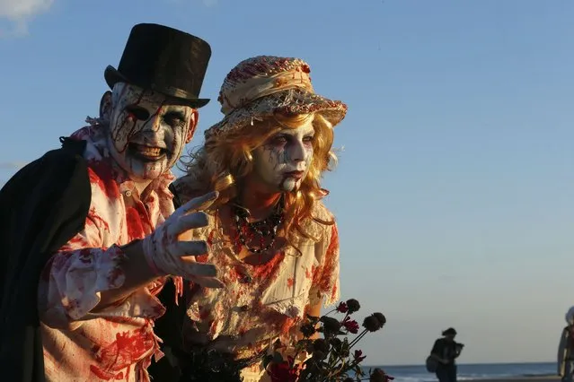 Revellers take part in a Zombie Walk in Asbury Park, New Jersey October 4, 2014. (Photo by Eduardo Munoz/Reuters)
