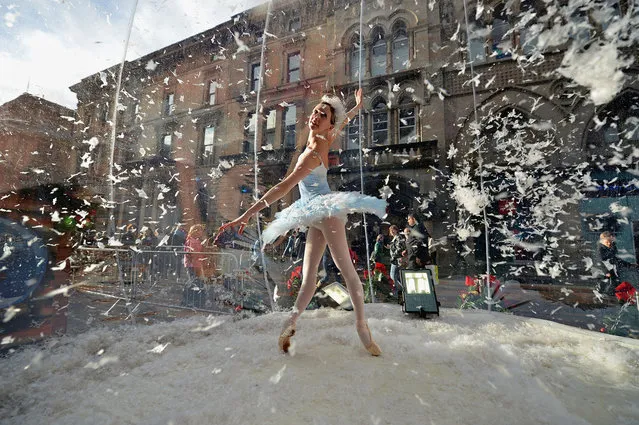 Claire Robertson from Scottish Ballet, poses dressed as the Good Snow Flake inside a life size snow globe on Buchanan Street during a promotion for Scottish Ballet’s festive production of The Nutcracker on November 20, 2012 in Glasgow, Scotland. The Nutcracker opens at the Theatre Royal on December the 8th, the production delves deep into the darker reaches of Hoffmann’s original tale in a fresh and vivid retelling of the famous Christmas story.  (Photo by Jeff J. Mitchell)