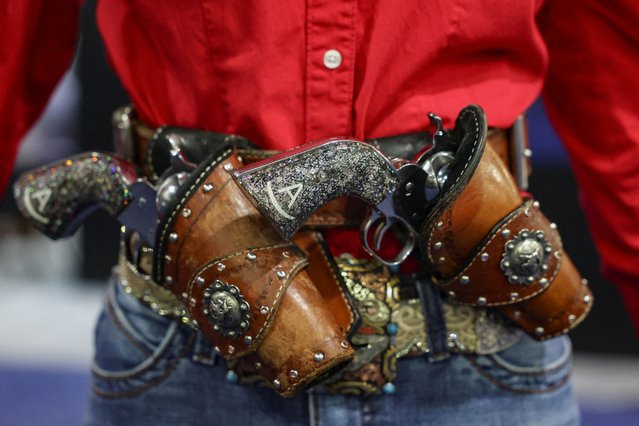 Annika Robbins from Georgia carries firearms on her belt during the NRA annual meeting in Atlanta, Georgia, U.S. April 27, 2025. (Photo by Jeenah Moon/Reuters)