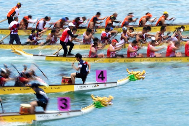 Teams compete during the International Dragon Boat races at Tsim Sha Tsui East Promenade in Hong Kong on June 7, 2025. (Photo by May James/AFP Photo)