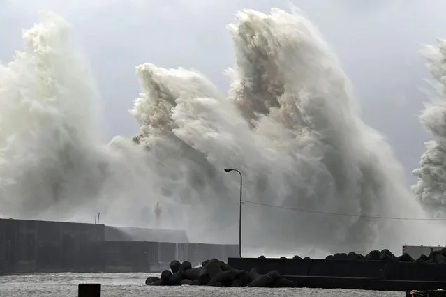 High waves hit the shore in Aki, Kochi Prefecture, Japan Monday, September 19, 2022. Typhoon Nanmadol slammed southwestern Japan with rainfall and winds Monday as it swerved north toward Tokyo. (Photo by Kyodo News via AP Photo)