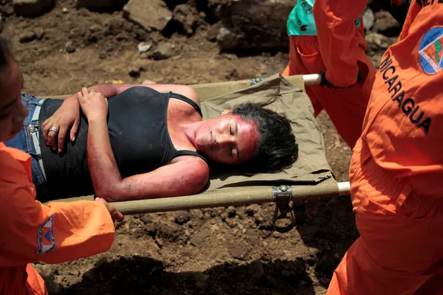 Civil defence members carry a participant playing the role of a victim during a national multi-hazard drill organized by the National System for Prevention, Mitigation and Attention to Disasters (SINAPRED), in the 30 de Mayo neighborhood in Managua, Nicaragua, September 26, 2016. (Photo by Oswaldo Rivas/Reuters)