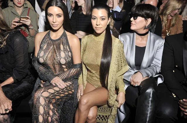 Kim Kardashian, Kourtney Kardashian, Kris Jenner and Corey Gamble attend the Balmain show as part of the Paris Fashion Week Womenswear Spring/Summer 2017 on September 29, 2016 in Paris, France. (Photo by Pascal Le Segretain/Getty Images)