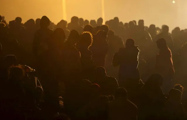 Migrants wait to cross the Slovenia-Austria border in Sentilj, Slovenia, October 27, 2015. (Photo by Srdjan Zivulovic/Reuters)