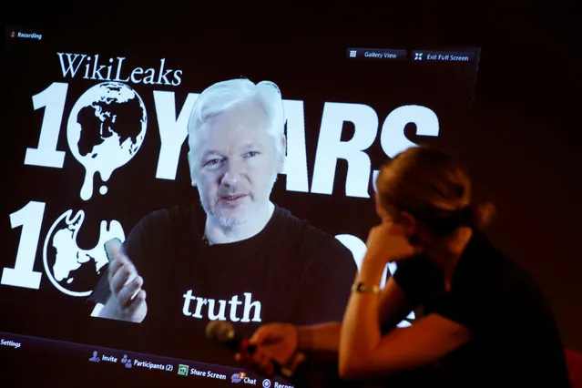 Julian Assange, Founder and Editor-in-Chief of WikiLeaks, via video link and Sarah Harrison, a WikiLeaks journalist, attend a press conference on the occasion of the 10 year anniversary celebration of WikiLeaks in Berlin, Germany, October 4, 2016. (Photo by Axel Schmidt/Reuters)