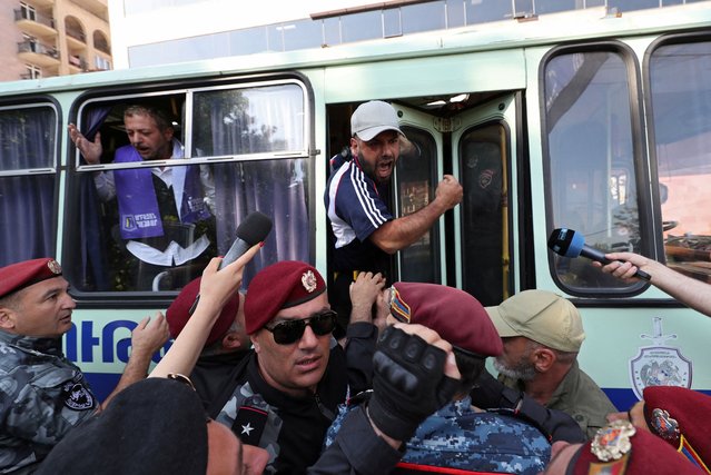 A demonstrator shouts from a police bus during an anti-government protest demanding the resignation of Armenian Prime Minister Nikol Pashinyan, in Yerevan, Armenia on May 27, 2024. (Photo by Hayk Baghdasaryan/Photolure via Reuters)