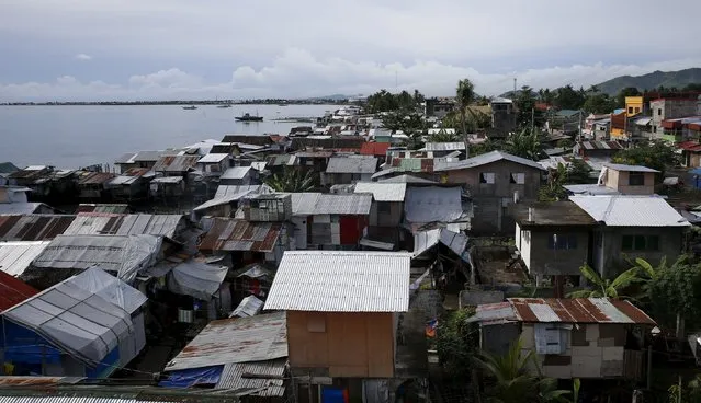 A view of a coastal village with most houses rebuilt after Typhoon Haiyan devastated a coastal village in Tacloban city in central Philippines November 2, 2015, ahead of the second anniversary of the devastating typhoon that killed more than 6,000 people in central Philippines. (Photo by Erik De Castro/Reuters)