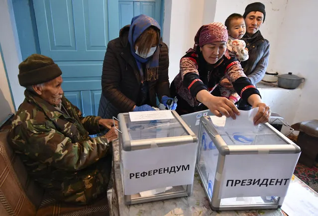 People vote during the presidential elections in Arashan village, about 15 kilometers (9,4 miles) south of Bishkek, Kyrgyzstan, Saturday, January 9, 2021. Voters in Kyrgyzstan are casting ballots in an early presidential election that follows the ouster of the nation's previous president. President Sooronbai Jeenbekov was forced to step down on Oct. 15 under pressure from demonstrators who challenged the results of a parliamentary vote earlier that month. (Photo by Vladimir Voronin/AP Photo)