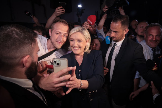 A handout photo made available by the official account of Marine Le Pen X (·MLP_officiel) shows Marine Le Pen (C), the candidate for the National Rally party, with  supporters at the end of the French election day in Paris, France, 01 July 2024. The far-right Marine Le Pen won a historic victory in the first round of the French elections, before which President Emmanuel Macron and numerous leaders of the left and center made calls for unity to prevent her from achieving an absolute majority. (Photo by Cuenta Oficial Marine Le Pen8 EPA)