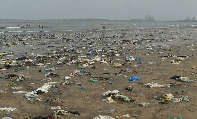 Plastic waste is pictured on Juhu beach in Mumbai, India on June 2, 2018. (Photo by Punit Paranjpe/AFP Photo)