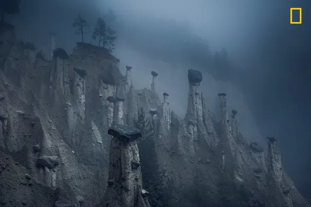 Third Place Winner, Nature: Mars. “These natural sand towers, capped with large stones, are known as the Earth Pyramids of Platten. They are situated in Northern Italy’s South Tyrol region. Formed centuries ago after several storms and landslides, these land formations look like a landscape from outer space and continuously change over the years and, more accurately, over seasons. This natural phenomenon is the result of continuous alternation between periods of torrential rain and drought, which have caused the erosion of the terrain and the formation of these pinnacles. As the seasons change, the temperatures move between extremes and storms affect the area, pyramids disappear over time, while new pinnacles form as well”. (Photo by Marco Grassi/National Geographic Travel Photographer of the Year Contest)