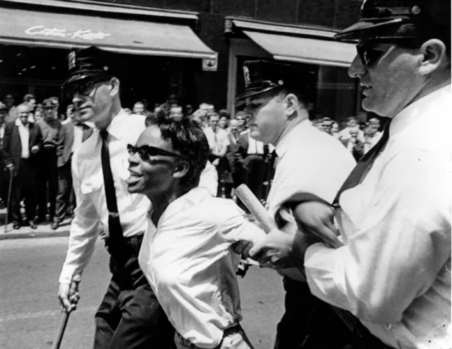 Bertha Gilbert, 22, is led away by police after she tried to enter a segregated lunch counter in Nashville, Tenn., on May 6, 1964. She is arrested on a disorderly conduct charge. (Photo by AP Photo)