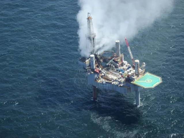 This photo released by the Bureau of Safety and Environmental Enforcement shows natural gas spewing from the Hercules 265 drilling rig in the Gulf of Mexico off the coast of Louisiana, Tuesday, July 23, 2013. No injuries were reported in the midmorning blowout and there was no fire as of Tuesday evening at the site, about 55 miles off the Louisiana coast in the Gulf of Mexico. (Photo by AP Photo/Bureau of Safety and Environmental Enforcement)