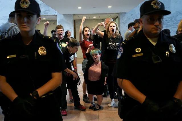 Protesters demonstrate against Judge Brett Kavanaugh's nomination to the U.S. Supreme Court in the atrium of the Hart Senate Office Building in Washington, U.S., October 4, 2018. (Photo by Mary F. Calvert/Reuters)