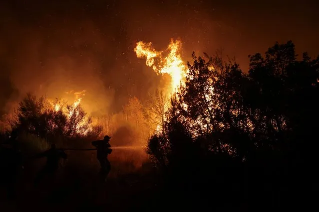 Firefighters try to extinguish a wildfire burning at the Dadia National Park in the region of Evros, Greece on September 3, 2023. (Photo by Alexandros Avramidis/Reuters)