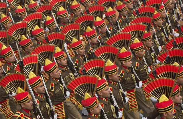Indian security forces march during the Republic Day parade in New Delhi, India, Tuesday, January 26, 2016. French President Francois Hollande Tuesday joined Indian Prime Minister Narendra Modi and other top officials to view an elaborate display of Indian marching bands and military hardware as the guest of honor at India's Republic Day celebration. (Photo by Bernat Armangue/AP Photo)