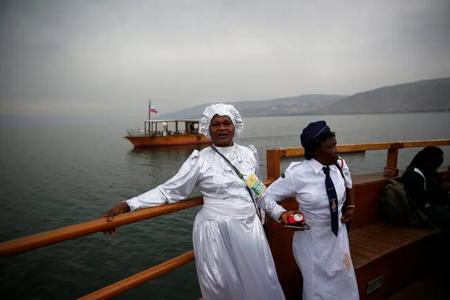 Christian tourists from Nigeria stand during a boat ride in the Sea of Galilee, northern Israel November 30, 2016. (Photo by Ronen Zvulun/Reuters)