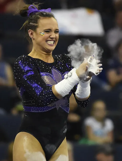 LSU's Jessie Jordan celebrates her 9.850 on the uneven bars during the NCAA college SEC gymnastics championship Saturday, March 21, 2015, in Duluth, Ga. (Photo by David Tulis/AP Photo)