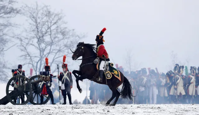 History enthusiasts, dressed as soldiers, fight during the re-enactment of Napoleon's famous battle of Austerlitz near the southern Moravian town of Slavkov u Brna, Czech Republic, December 1, 2018. (Photo by David W. Cerny/Reuters)