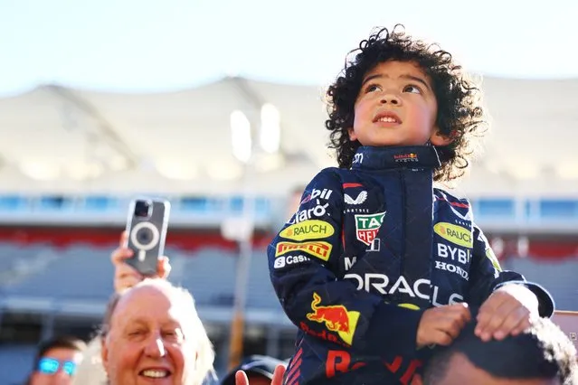 A young Red Bull Racing fan looks on in the Pitlane during previews ahead of the F1 Grand Prix of United States at Circuit of The Americas on October 19, 2023 in Austin, Texas. (Phoot by Mark Thompson/Getty Images/AFP Photo)
