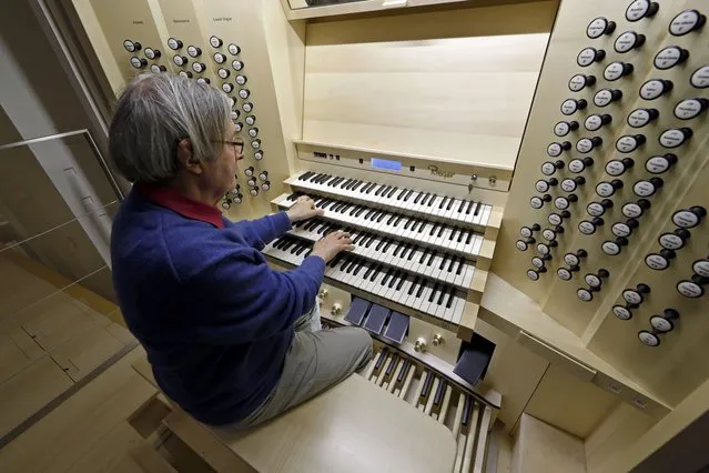 Michel Garnier, renowned harmonist, plays the new Rieger organ at the Paris Philharmonic Hall (Philharmonie de Paris) in Paris, France, February 12, 2016. With 6,055 handmade pipes, the new Rieger organ of the Philharmonie de Paris is 15 meters high and 16 meters wide, with 91 stops on four keyboards and pedals specially designed for the symphonic repertory. (Photo by Benoit Tessier/Reuters)