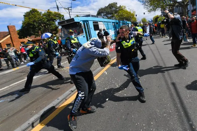 Victoria Police clash with Protesters during a “The Worldwide Rally for Freedom” in Melbourne, Saturday, September 18, 2021. The Worldwide Rally for Freedom is a purported day of rallies for “freedom” across many countries, which is also labelled “World Wide Demonstration 4.0”. (Photo by James Ross/AAP Image)