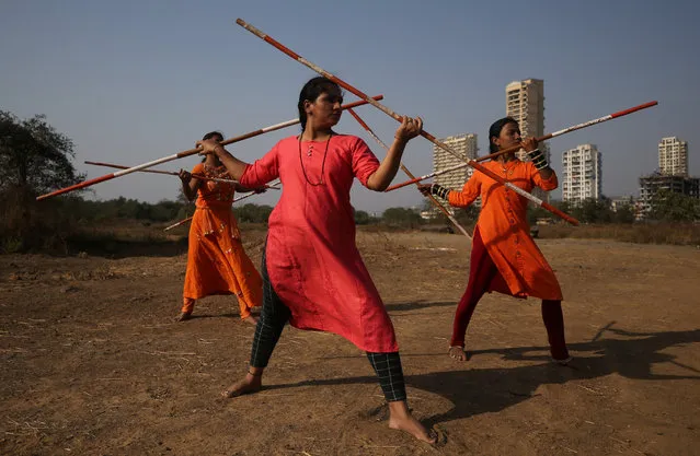 Women practice Shivkalin Yudha Kala, a Maharashtrian martial art on the eve of International Women's Day, at a ground on the outskirts of Mumbai, India March 7, 2019. (Photo by Francis Mascarenhas/Reuters)