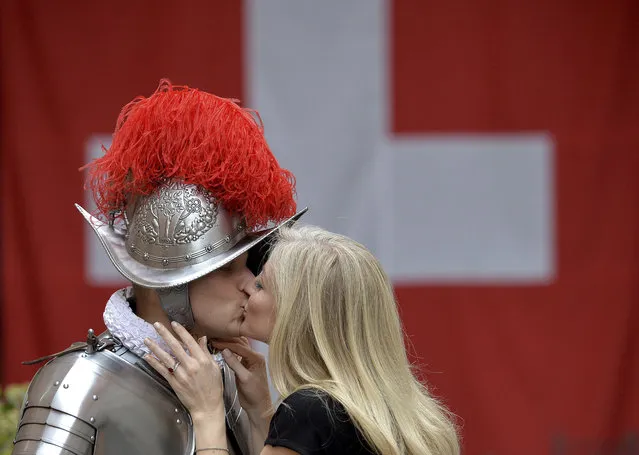 Dominic Bergamin, left, a new Vatican Swiss Guard, is is kissed by his wife Joanne, prior to a swearing-in ceremony, at the Vatican, Wednesday, May 6, 2015. (Photo by Ettore Ferrari/AP Photo/Pool Photo)