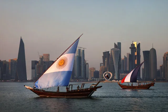 Boats with sails showing the flags of the nations Argentina and France who will play in the final match sail in-front of the Doha skyline on The Corniche during the FIFA World Cup Qatar 2022 on December 15, 2022 in Doha, Qatar. (Photo by Alex Pantling/Getty Images)