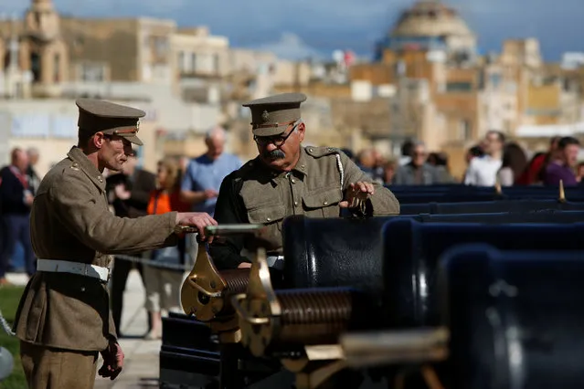 Malta Heritage Trust historical re-enactors, in World War One-era Royal Malta Artillery uniforms, prepare to fire the cannons in a general salute to mark the feast of Saint Paul's Shipwreck at the Upper Barrakka Saluting Battery, in Valletta, Malta February 10, 2017. (Photo by Darrin Zammit Lupi/Reuters)