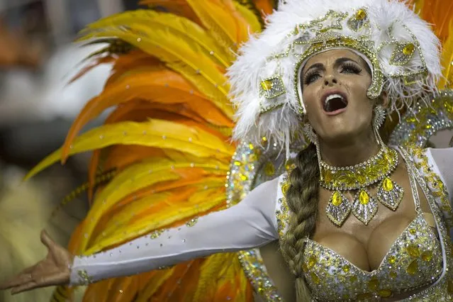 A performer from the Vila Isabel samba school parades during carnival celebrations at the Sambadrome in Rio de Janeiro, Brazil, Tuesday, March 4, 2014. (Photo by Felipe Dana/AP Photo)