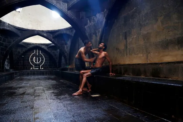 A Yemeni man takes a steam bath at a Turkish bathhouse in Sanaa, Yemen, on November 14, 2021. (Photo by Xinhua News Agency/Rex Features/Shutterstock)