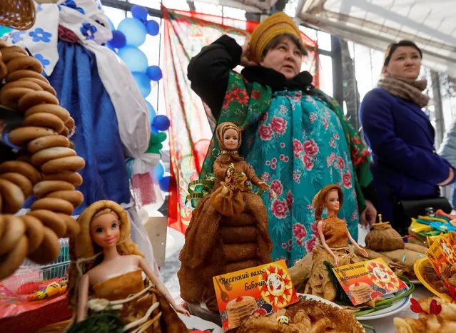 Dolls decorated with pancakes are pictured at a fair for celebration of Maslenitsa, or Pancake Week, in Almaty, Kazakhstan, February 25, 2017. (Photo by Shamil Zhumatov/Reuters)