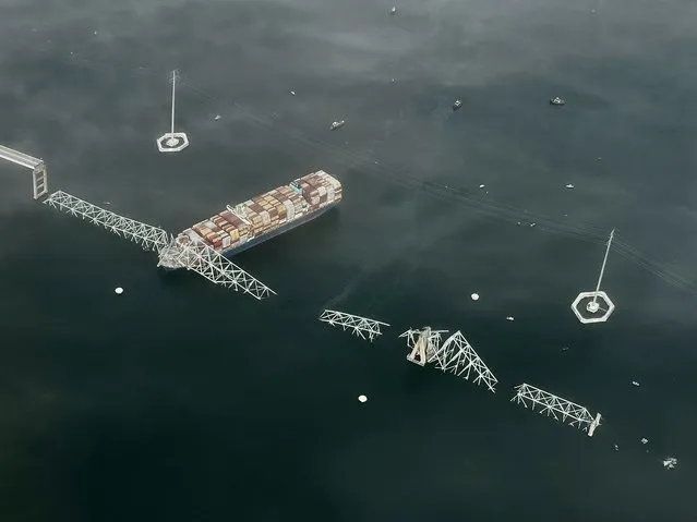 The Singapore-flagged container vessel Dali and the collapse of Francis Scott Key Bridge near Baltimore, Maryland on March 26, 2024.  (Photo by Carolyn Van Houten/The Washington Post)