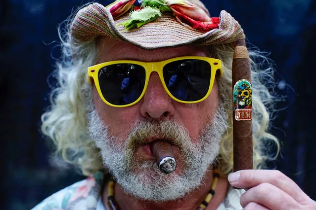 Jim Robinson of the U.S. poses for a photo holding a cigar of his own brand in Havana, Cuba, March 1, 2017. Picture taken March 1, 2017. (Photo by Alexandre Meneghini/Reuters)