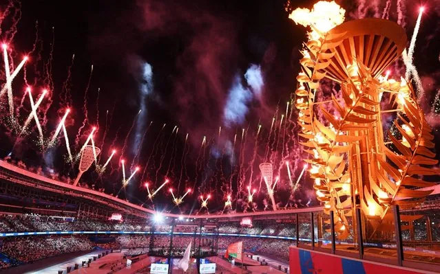 A picture shows fireworks display as the torch lighting the cauldron during the opening ceremony of the 2019 European Games at the Dinamo Stadium in Minsk, Belarus late on June 21, 2019. The second European Games will run from June 21 to 30, 2019. (Photo by Kirill Kudryavtsev/AFP Photo)