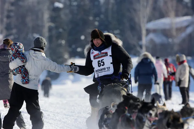 John Baker competes in the official restart of the Iditarod, a nearly 1,000 mile (1,610 km) sled dog race across the Alaskan wilderness, in Fairbanks, Alaska, U.S. March 6, 2017. (Photo by Nathaniel Wilder/Reuters)