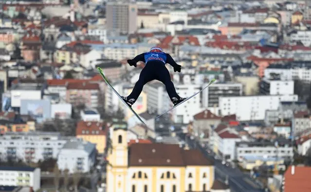Germany's Markus Eisenbichler soars through the air during a training jump of the ski jumping event in Innsbruck, Austria, on January 3, 2022, that is part of the Four-Hills Ski Jumping tournament (Vierschanzentournee). (Photo by Christof Stache/AFP Photo)