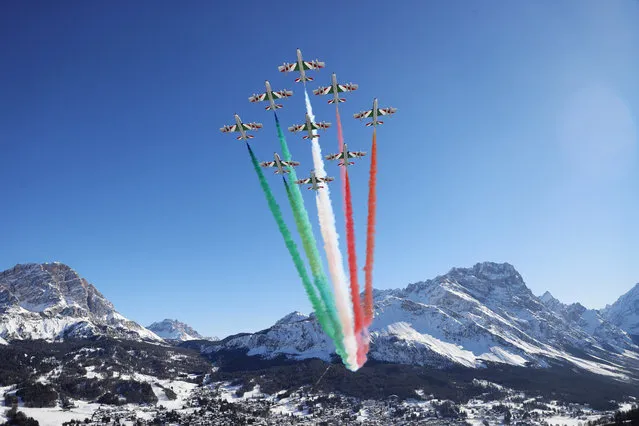 A flyover performed by The Frecce Tricolori (“Tricolor Arrows”) is pictured prior to the FIS World Ski Championships Men's Downhill on February 14, 2021 in Cortina d'Ampezzo, Italy. (Photo by Leonhard Foeger/Reuters)