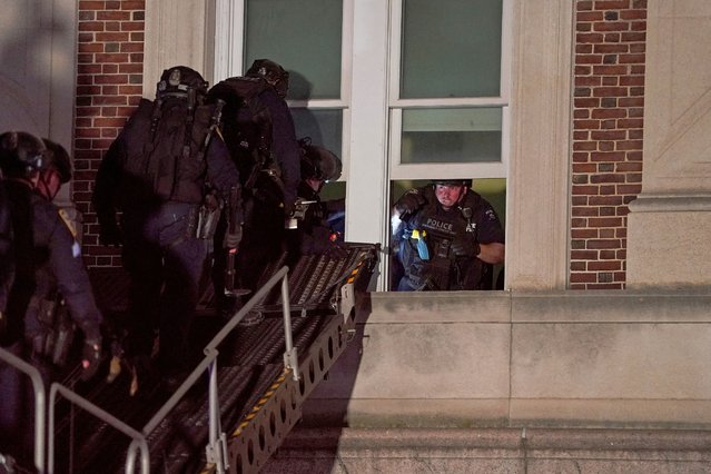 Police use a special vehicle to enter Hamilton Hall which protesters occupied, as other officers enter the campus of Columbia University, in New York City on April 30, 2024. (Photo by David Dee Delgado/Reuters)