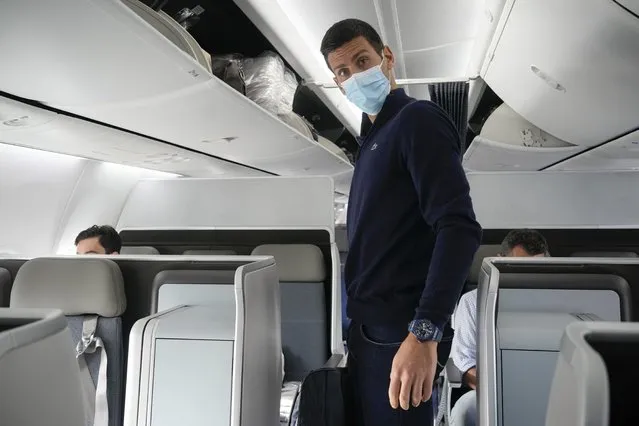 Novak Djokovic prepares to take his seat on a plane to Belgrade, in Dubai, United Arab Emirates, Monday, January 17, 2022. Djokovic was deported from Australia on Sunday after losing a bid to stay in the country to defend his Australian Open title despite not being vaccinated against COVID-19. (Photo by Darko Bandic/AP Photo)
