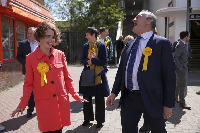 Ed Davey (R), Leader of the Liberal Democrats and Luisa Porritt, Liberal Democrat Mayoral Candidate laugh as they campaign in Surbiton on May 5, 2021 in London, England. Local elections are due to be held across the United Kingdom on May 6, 2021, for 145 English local councils, thirteen directly elected mayors in England, and 39 police and crime commissioners across England and Wales. (Photo by Dan Kitwood/Getty Images)