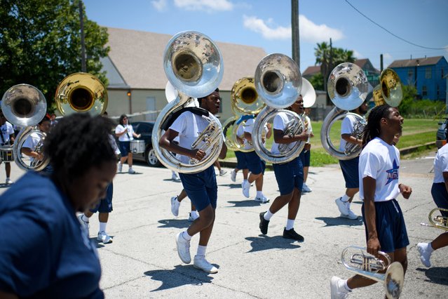 A marching band performs during the 45th annual Juneteenth National Independence Day celebrations in Galveston, Texas, on June 15, 2024. Juneteenth falls on June 19 and has often been celebrated on the third Saturday in June, to mark the end of slavery in the US. (Photo by Mark Felix/AFP Photo)