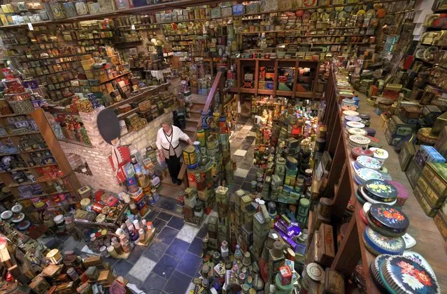 Yvette Dardenne, 83, from Belgium, describing herself as a “buxidaferrophile”, stands among thousands of vintage lithographed tin boxes, which are part of a huge collection of almost 60,000 pieces started 30 years ago, at her house in Grand-Hallet, Belgium on August 5, 2021. (Photo by Yves Herman/Reuters)