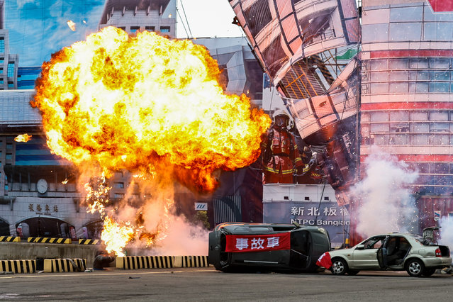 An explosion at a scenery during a war and disaster drill as part of the annual Wan-An Air Raid Drill, at a seaport in New Taipei, Taiwan, on 23 July, 2024. The drill, which coincides with the annual Han Kuang Exercise, is joint by nearly 2,000 individuals from government agencies including the military, fire fighting and rescue services. It is held to simulate emergency responses to huge disasters and attacks by China, as Beijing has increased its military presence in the Taiwan Strait. (Photo by Daniel Ceng/Anadolu via Getty Images)